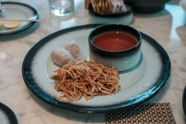 Chinese breakfast food goes far beyond fried rice — congee, youtiao, jianbing, and dim sum explained, with regional differences and real Chinese terms.